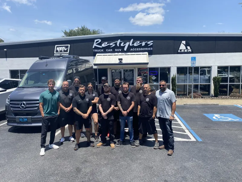 A restyling shop team outside their store