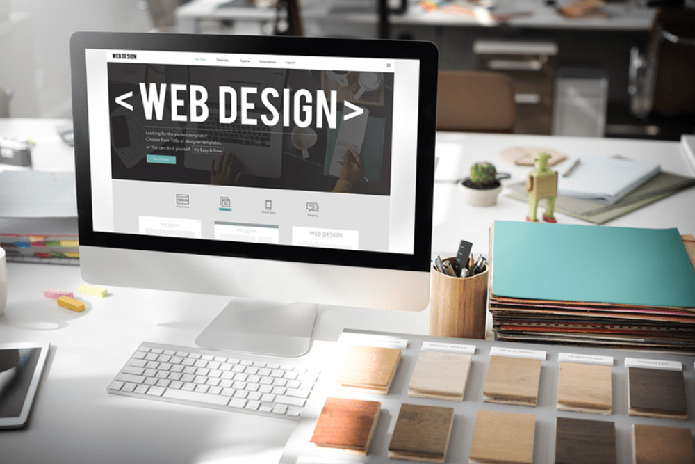 A desktop showing some website design